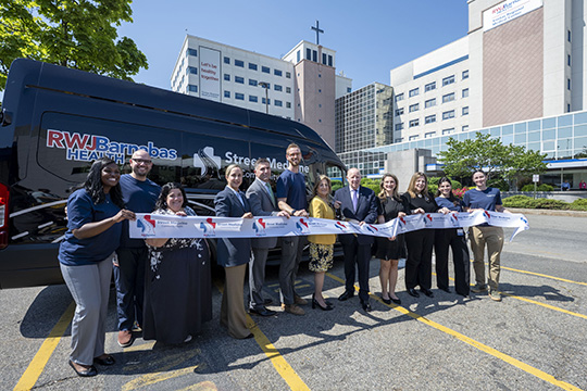 RWJBarnabas Health leadership and Trinitas Regional Medical Center staff join local officials to cut the ribbon for the Street Medicine Program