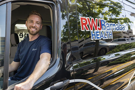 Edward Egan, MD, Street Medicine Medical Director, RWJBarnabas Health drives the new Street Medicine Team Mobile Unit.
