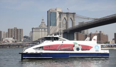 Five NYC Ferry vessels have been custom-wrapped to celebrate the identity of each borough. The Queens ferry, “Waves of Wonder,” is shown next to the Brooklyn Bridge. Photo: NYCEDC