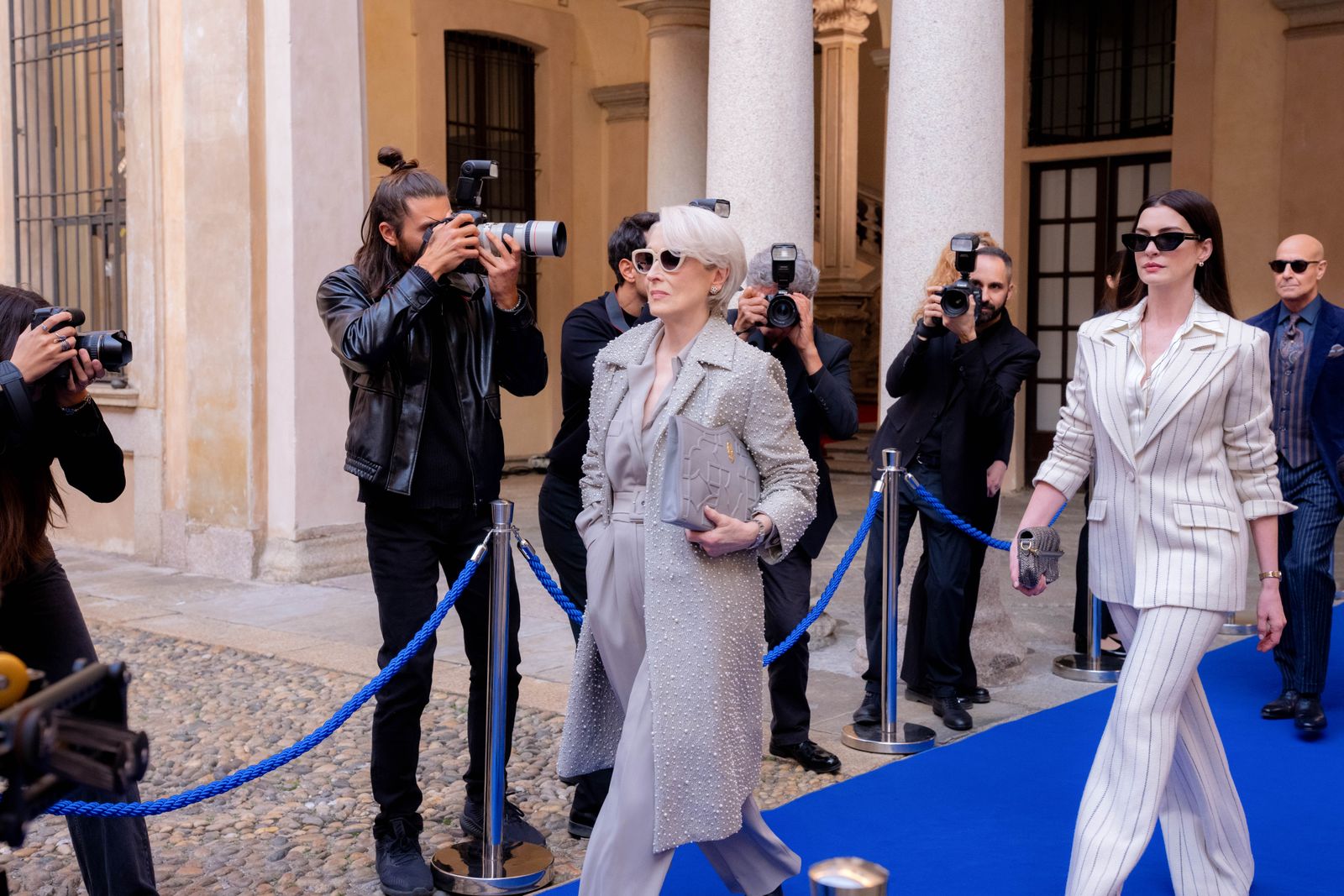Image may contain Meryl Streep Mike Edel Person Adult Paparazzi Wedding Clothing Coat Accessories Glasses and Bag
