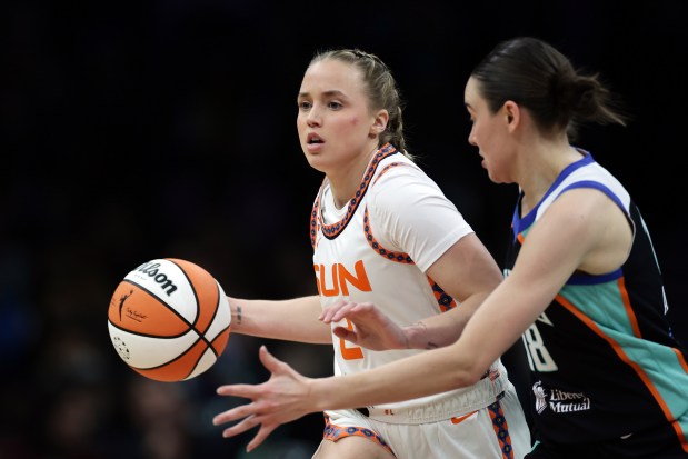 Connecticut Sun guard Hailey Van Lith (2) controls the ball past New York Liberty guard Pauline Astier (18) during a WNBA basketball game in New York on Friday, May 8, 2026. (AP Photo/Adam Hunger)