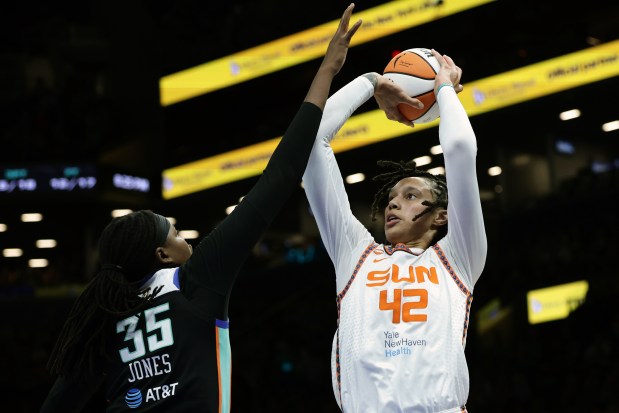 Connecticut Sun center Brittney Griner (42) shoots over New York Liberty center Jonquel Jones (35) during a WNBA basketball game in New York on Friday, May 8, 2026. (AP Photo/Adam Hunger)
