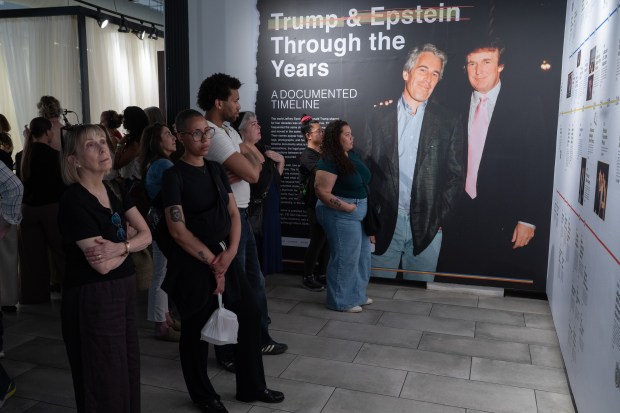 People view an exhibit in the "The Donald J. Trump and Jeffrey Epstein Reading Room" which holds copies of the 3,747 bound volumes of publicly released Epstein files at the Reading Room in Tribeca Monday, May 18, 2026 in Manhattan, New York. (Barry Williams/ New York Daily News)