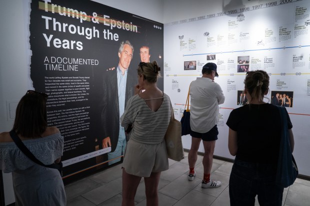 People view an exhibit in the "The Donald J. Trump and Jeffrey Epstein Reading Room" which holds copies of the 3,747 bound volumes of publicly released Epstein files at the Reading Room in Tribeca Monday, May 18, 2026 in Manhattan, New York. (Barry Williams/ New York Daily News)