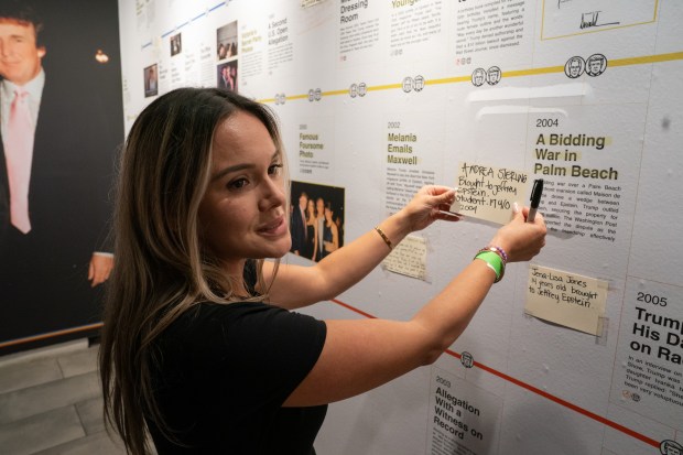 Epstein survivor Andrea Sterling posts a note on an exhibit holding 3,747 bound volumes of publicly released Epstein files at the Reading Room in Tribeca Monday, May 18, 2026 in Manhattan, New York. The 24-hour live stream of people reading from the Jeffrey Epstein files was produced by Save America Movement. (Barry Williams/ New York Daily News)
