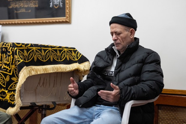 The father of bodega worker Abdul Saleh, Ahmed Saleh, prays next to his son's coffin Thursday, April 30, 2026 in Brooklyn, New York. (Barry Williams/ New York Daily News)