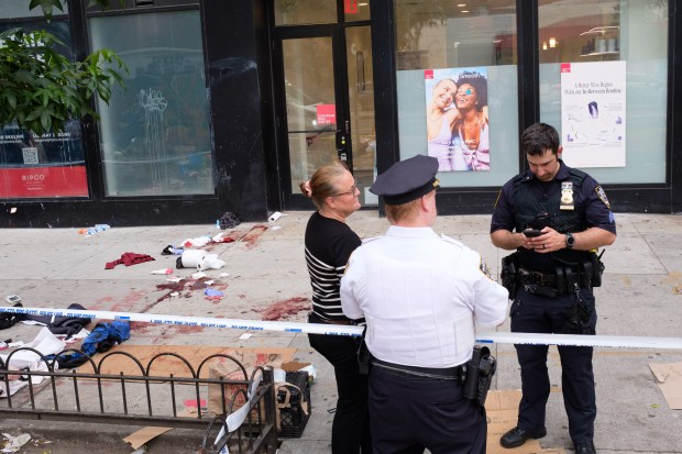 Police investigate stabbings on E. 14th St. near Avenue A in Manhattan, New York on Sunday, June 23 2024. (Gardiner Anderson for New York Daily News)