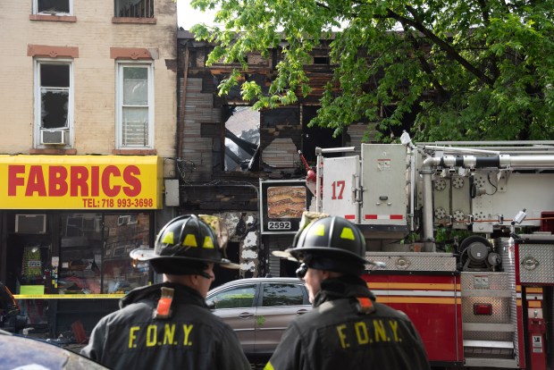 Firefighters respond to a fatal fire on 3rd Ave. near E. 140th St. in the Bronx on Wednesday, May 6, 2026. (Gardiner Anderson / New York Daily News)