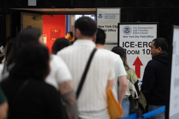 People line up for ICE appointments at the Jacob Javits Federal Building on Wednesday. 