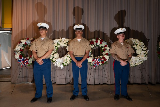 A Marine Corps honor guard stands by wreaths to be laid in honor of fallen veterans during the annual Memorial Day commemoration ceremony at the Intrepid Museum Monday, May 25, 2026 in Manhattan, New York. (Barry Williams/ New York Daily News)