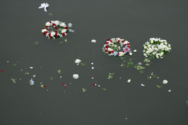 Wreaths float in the Hudson River near the Intrepid Museum after dignitaries tossed wreaths during the annual Memorial Day commemoration ceremony Monday, May 25, 2026 in Manhattan, New York. (Barry Williams/ New York Daily News)