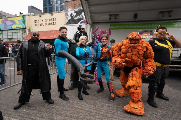 Fans dressed as Marvel Comic characters pose for fellow fans after a street renaming for Jack Kirby Way at Essex St. and Delancey St. Monday, May 11, 2026 in Manhattan, New York. (Barry Williams/ New York Daily News)