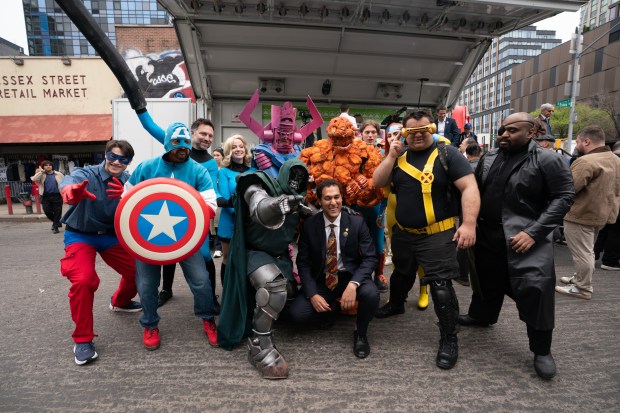 Marvel Comic characters pose with City Council Member Christopher Marie after a street renaming for Jack Kirby Way at Essex St. and Delancey St. Monday, May 11, 2026 in Manhattan, New York. (Barry Williams/ New York Daily News)