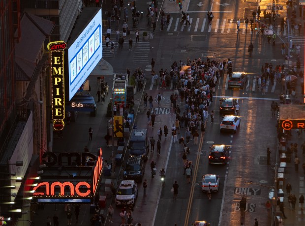 People watch 'Manhattanhenge' on W. 42nd St. in Manhattan on Thursday, May 28, 2026, in New York City. (Barry Williams / New York Daily News)