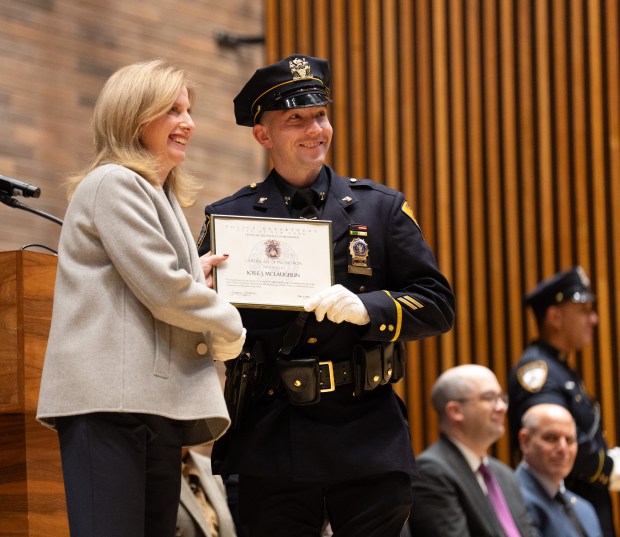 Det. Kyle McLaughlin poses with NYPD Commissioner Jessica Tisch during a ceremony at One Police Plaza where he was promoted to detective on Friday. 