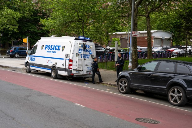 An 18-year-old man was taken to Saint Barnabas Hospital after he was shot in the abdomen on Webster Ave. in the Bronx on Thursday, May 21, 2026. An FDNY ambulance, which was parked a short distance away, sustained gunshot damage to the front and rear windshields. (Theodore Parisienne / New York Daily News)