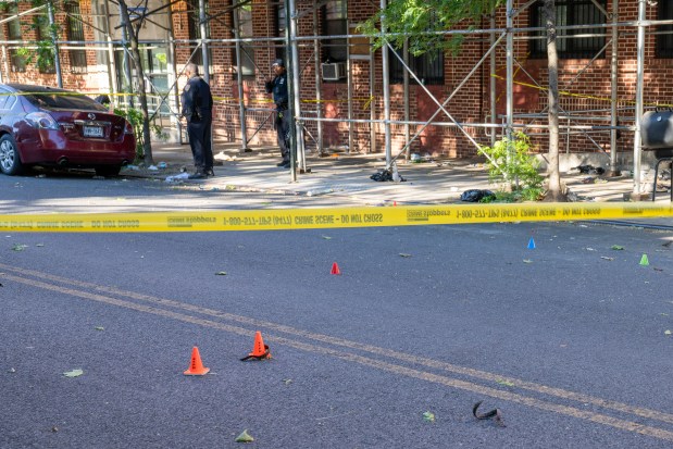 Police investigate after one person was shot in the hand and eight people were arrested after more than a dozen shots were fired outside an apartment building on Ralph Ave. near East New York Ave. in Brownsville, Brooklyn, early Saturday, May 30, 2026. (Theodore Parisienne / New York Daily News)
