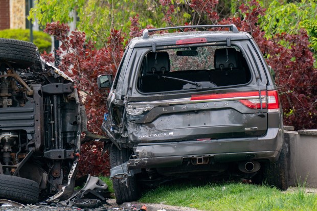 Police investigate after a man operating a black Chevy Tahoe SUV eastbound on Gannon Ave. South was killed after he lost control of the vehicle and crashed it into multiple vehicles between Ardmore Ave. and Sheraden Ave. in Staten Island on Saturday, May 2, 2026. (Theodore Parisienne / New York Daily News)