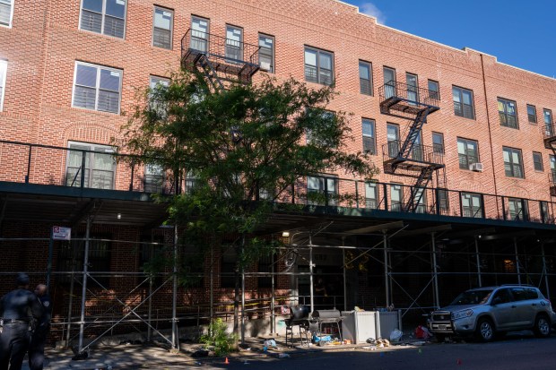 Police investigate after one person was shot in the hand and eight people were arrested after more than a dozen shots were fired outside an apartment building on Ralph Ave. near East New York Ave. in Brownsville, Brooklyn, early Saturday, May 30, 2026. (Theodore Parisienne / New York Daily News)