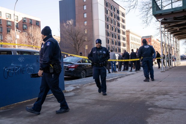 A 14-year-old boy was pronounced dead at Lincoln Hospital after he was found with two stab wounds to his chest behind NYCHA's Mitchel Houses on E. 138th St. near Alexander Ave. in the Bronx on Friday. (Theodore Parisienne / New York Daily News)