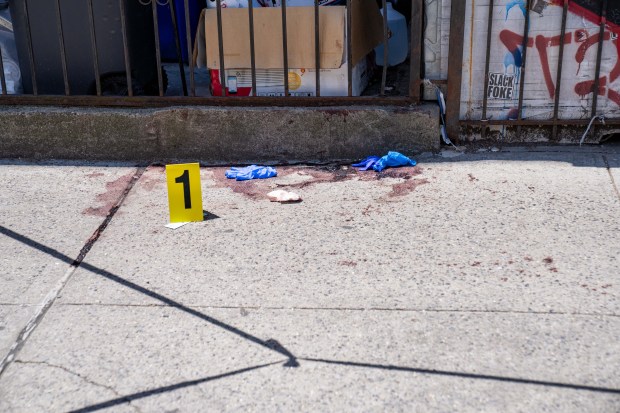 Police investigate after a 35-year-old man was fatally stabbed and a second man was slashed on 6th Ave. near 50th St. in Sunset Park, Brooklyn early Thursday, May 28, 2026. The suspect, who was also injured in the clash, left a blood trail down 6th Ave. (Theodore Parisienne / New York Daily News)