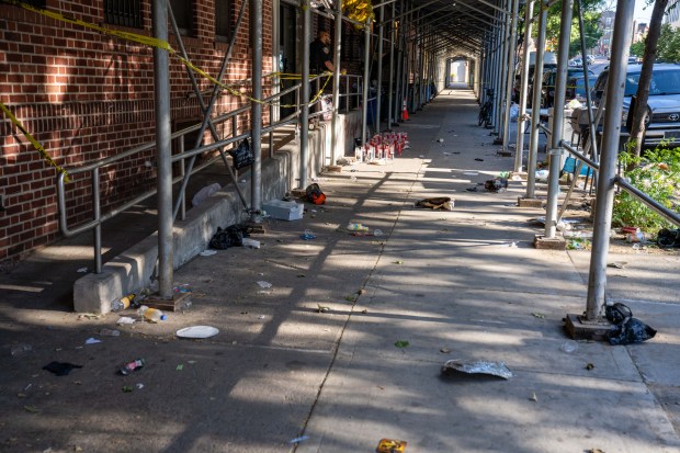 Police investigate after one person was shot in the hand and eight people were arrested after more than a dozen shots were fired outside an apartment building on Ralph Ave. near East New York Ave. in Brownsville, Brooklyn, early Saturday, May 30, 2026. (Theodore Parisienne / New York Daily News)