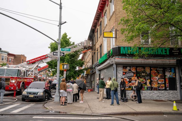 Firefighters respond to the fatal fire on Nostrand Avenue in Brooklyn on Saturday.