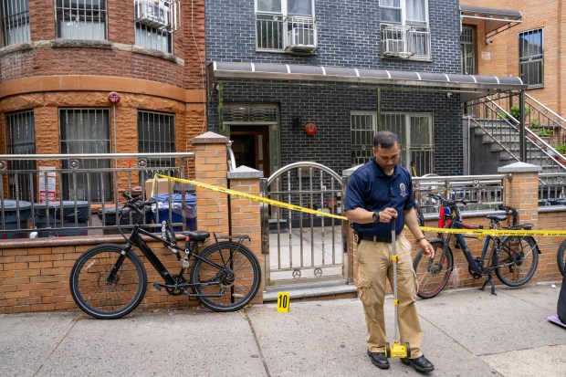 Police investigate after a 35-year-old man was fatally stabbed and a second man was slashed on 6th Ave. near 50th St. in Sunset Park, Brooklyn early Thursday, May 28, 2026. The suspect, who was also injured in the clash, left a blood trail down 6th Ave. (Theodore Parisienne / New York Daily News)