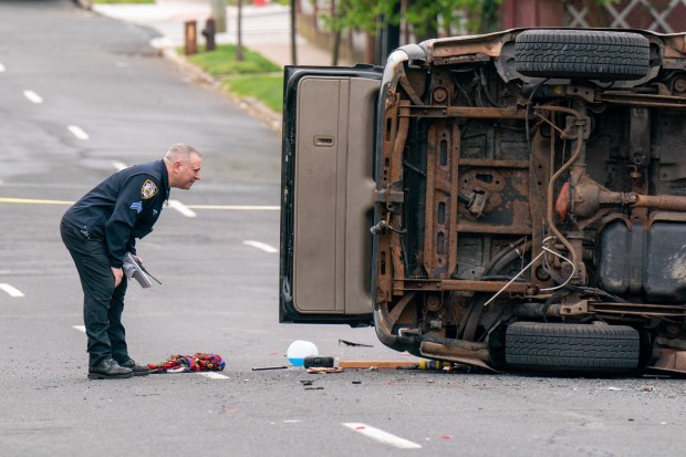 Police investigate after a man operating a black Chevy Tahoe SUV eastbound on Gannon Ave. South was killed after he lost control of the vehicle and crashed it into multiple vehicles between Ardmore Ave. and Sheraden Ave. in Staten Island on Saturday, May 2, 2026. (Theodore Parisienne / New York Daily News)