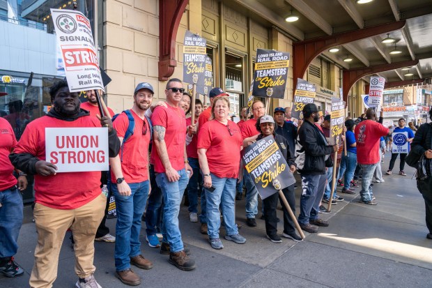 LIRR workers picket outside Jamaica Stationon Saturday.