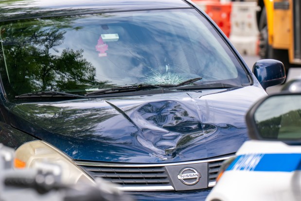 A 13-year-old boy suffered serious head injuries when he was struck by a blue Nissan Versa that was driving southbound on 15th Ave. at 38th St. in Brooklyn on Friday, May 8, 2026. (Theodore Parisienne / New York Daily News)