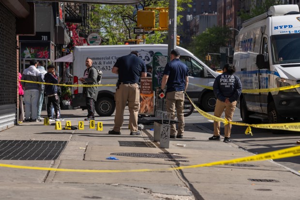 NYPD detectives and officers investigate a double-stabbing on 9th Ave. near W. 52nd St. in Manhattan on Thursday, April 23, 2026. (Barry Williams/ New York Daily News)