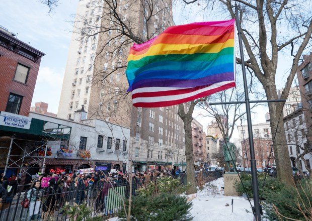 Conjoined flags, an American flag and a Pride flag, fly together at the Stonewall National Monument on Thursday, Feb. 11, 2026 in Manhattan, New York.