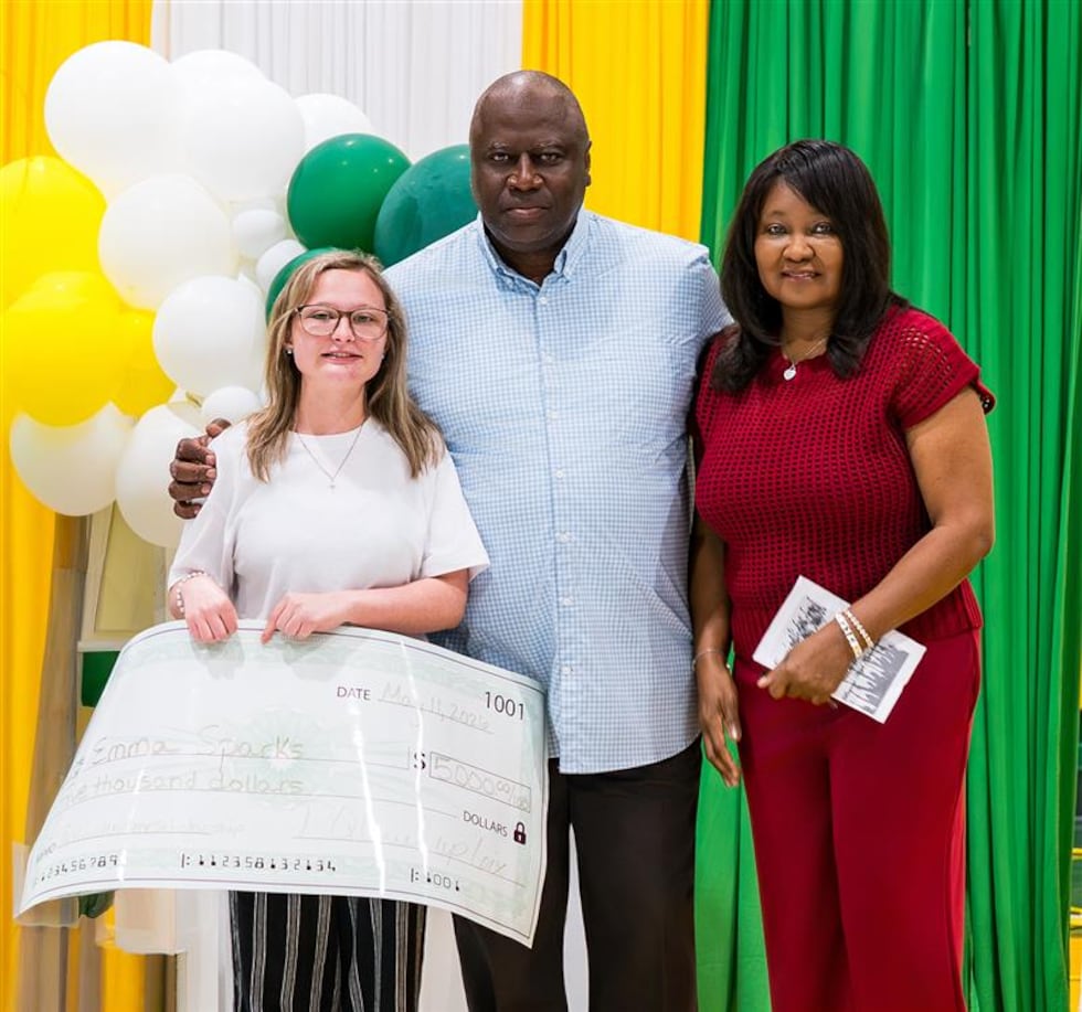 Emma Sparks receives one of Patrick Queen's inaugural athletic scholarship awards for...