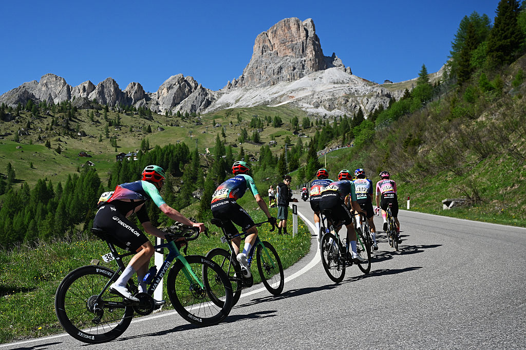 Johannes Staune-Mittet, Callum Scotson of Australia, Felix Gall and, Gregor Muhlberger of Team Decathlon CMA CGM climbing to the Passo Giau at the back of the pink jersey group