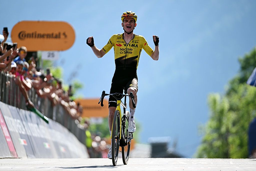 Sepp Kuss celebrates atop the final climb