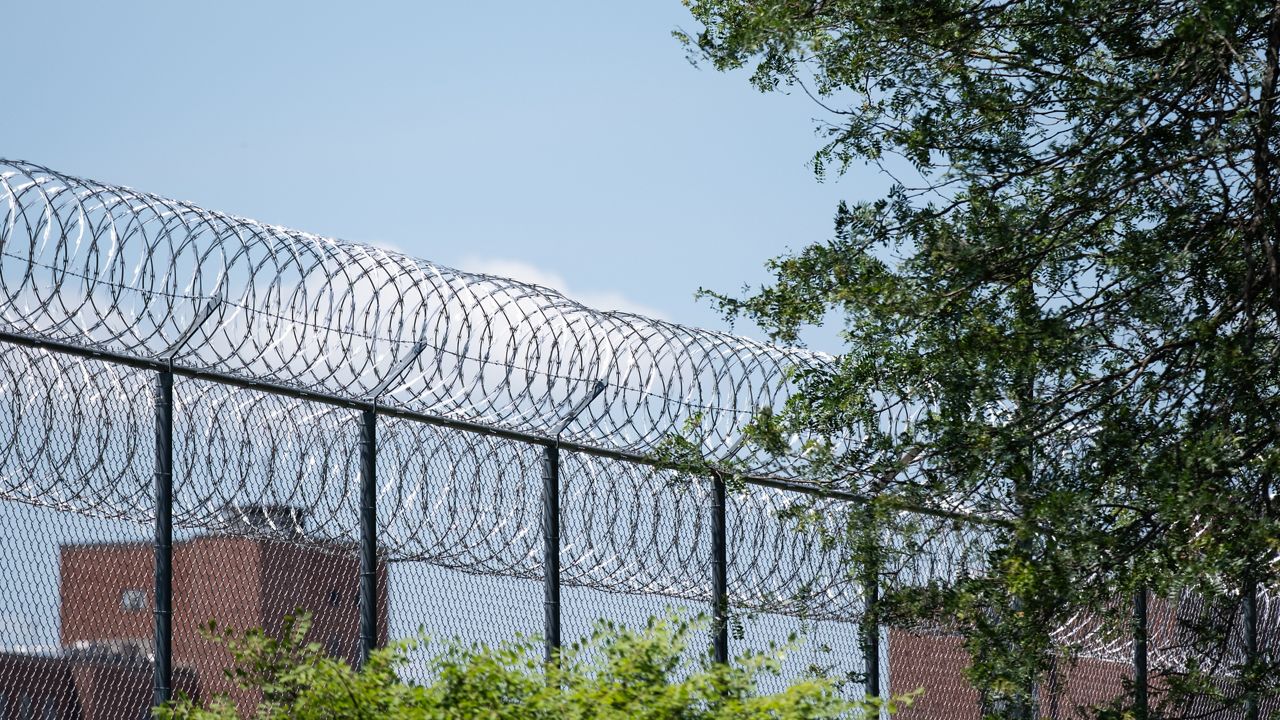 barbed wire fence outside mid-state correctional facility