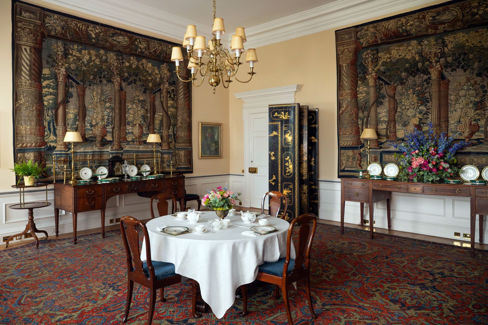 Image may contain Architecture Building Dining Room Dining Table Furniture Indoors Room Table Chandelier and Lamp