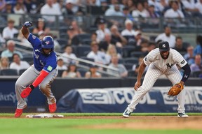 Blue Jays' Vladimir Guerrero Jr. slides into third base past Yankees' Amed Rosario during the fourth inning at Yankee Stadium on May 18, 2026. Ishika Samant/Getty Images