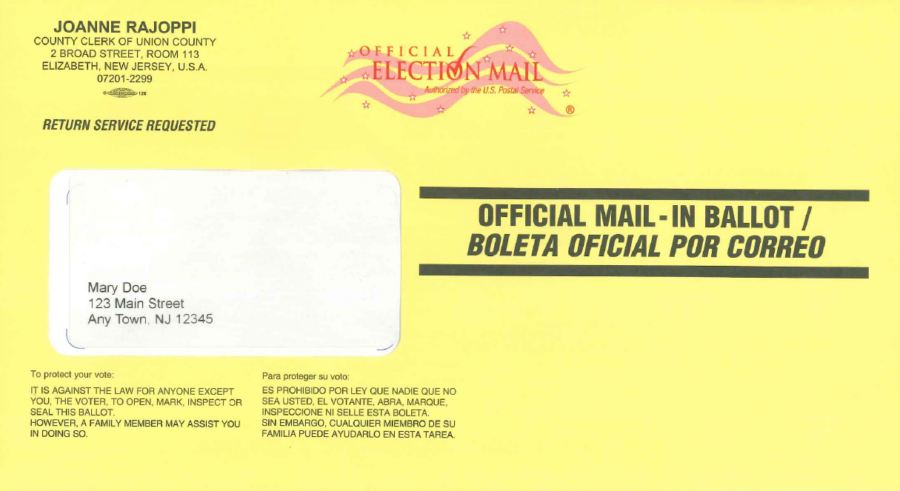 A photo of a yellow vote-by-mail ballot envelope.