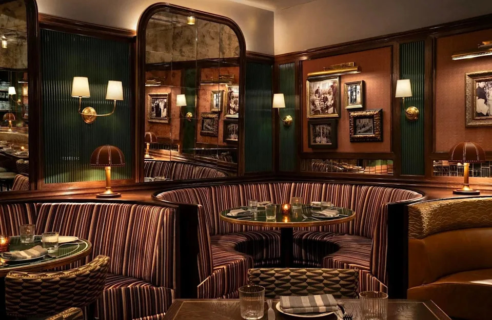 Cozy restaurant interior featuring plush seating and vintage decor.