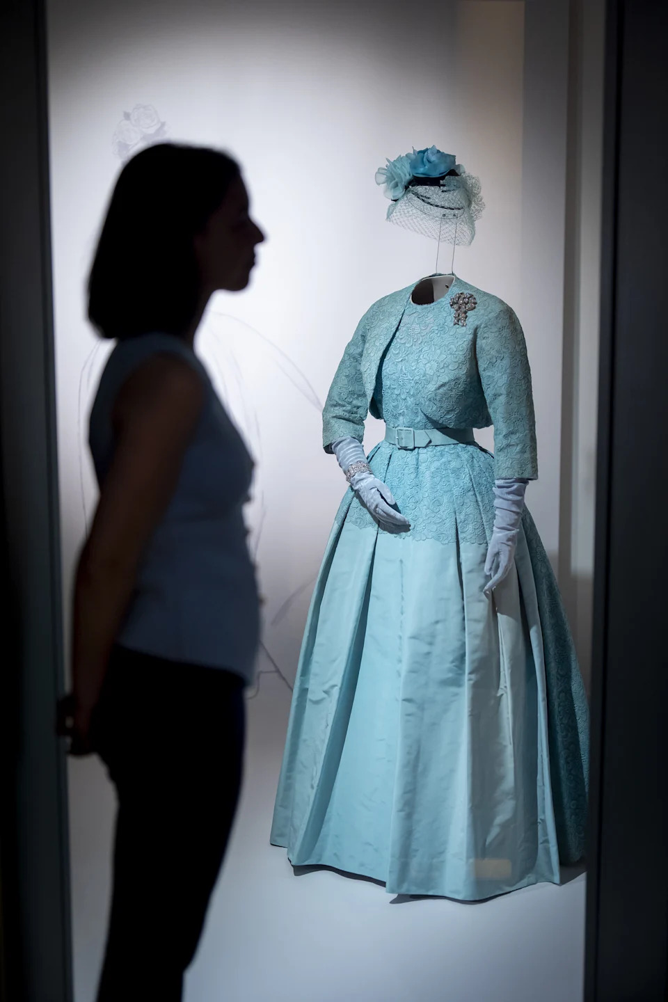 An Ensemble worn for the Wedding of Princess Margaret and Mr Antony Armstrong-Jones, 9 May 1960 part of 'Queen Elizabeth II: Her Life in Style'. The largest exhibition of the Queen's fashion ever staged features approximately 300 pieces of clothing and accessories, around half on display for the first time, and charts the story of Britain's longest-reigning monarch through clothing worn in all ten decades of her life. Marking the centenary of the Queen's birth the exhibition opens to the public at The King's Gallery, Buckingham Palace in London from April 10. Picture date: Thursday April 9, 2026.