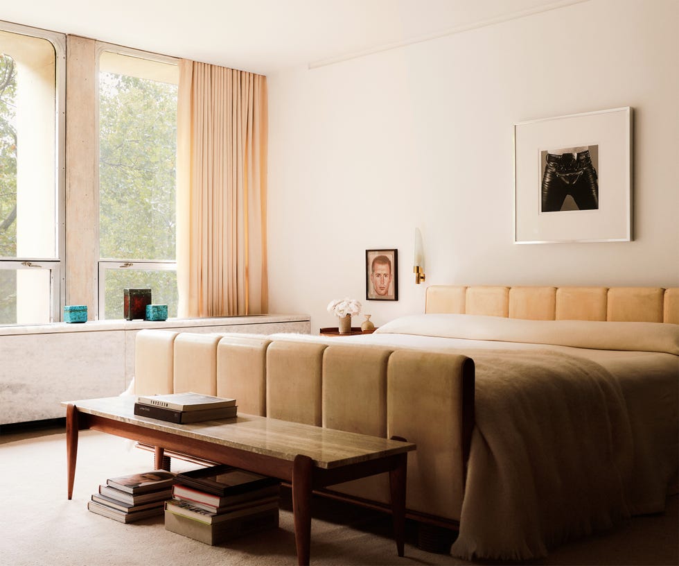 Modern bedroom with soft furnishings and decor.