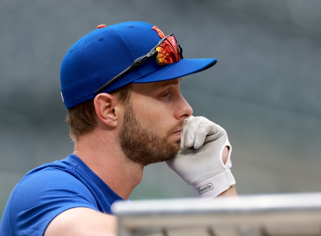 New York Mets player Austin Slater looks on during batting practice.