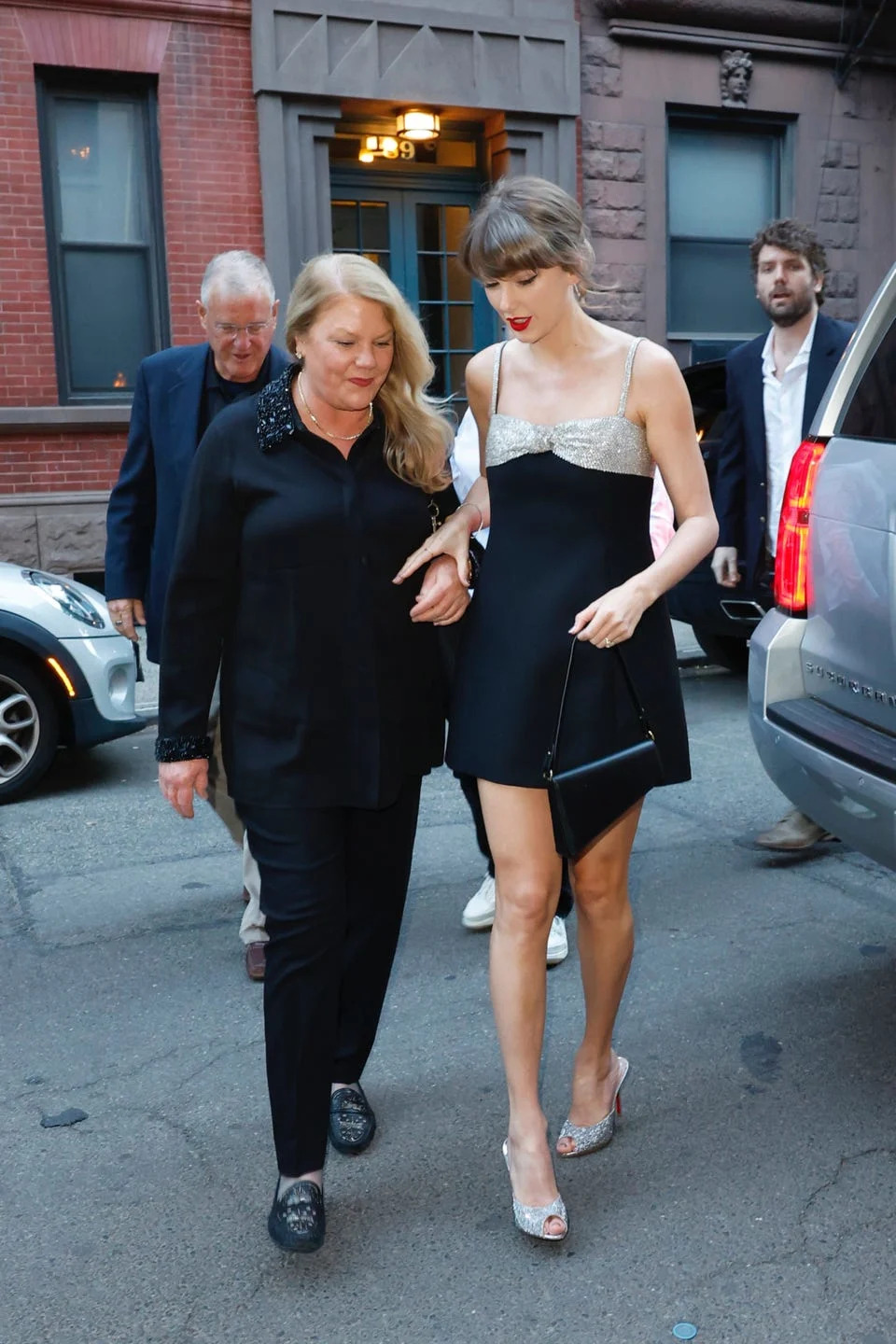 Two women walking together on a city street.