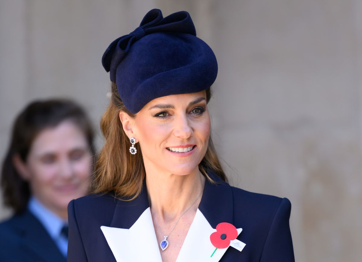 Kate Middleton’s soft waves and luminous makeup complete her understated look.