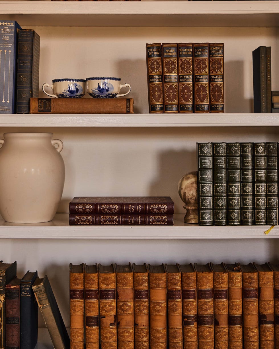 Books and decorative items on shelves. Books and decorative items on shelves.