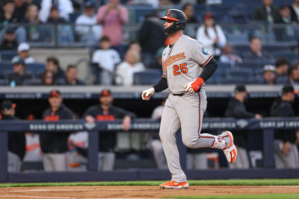 Baltimore Orioles first baseman Pete Alonso (25) scores a solo home run against the New York Yankees.