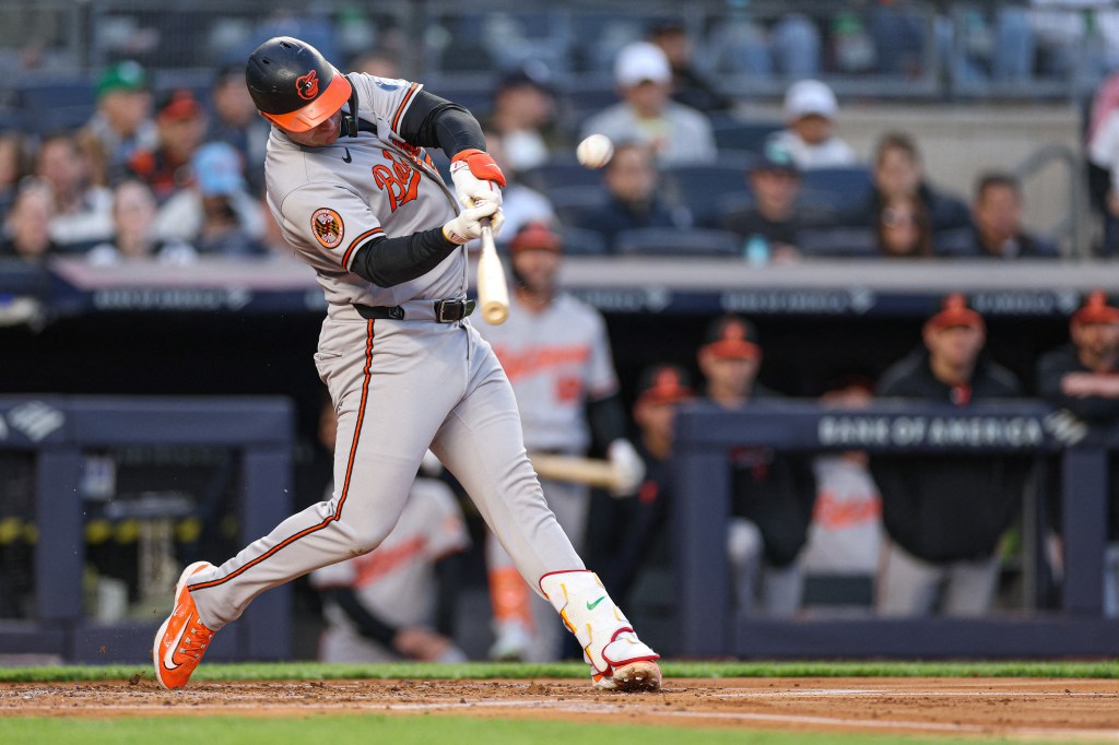 Baltimore Orioles first baseman Pete Alonso (25) hits a solo home run against the New York Yankees.