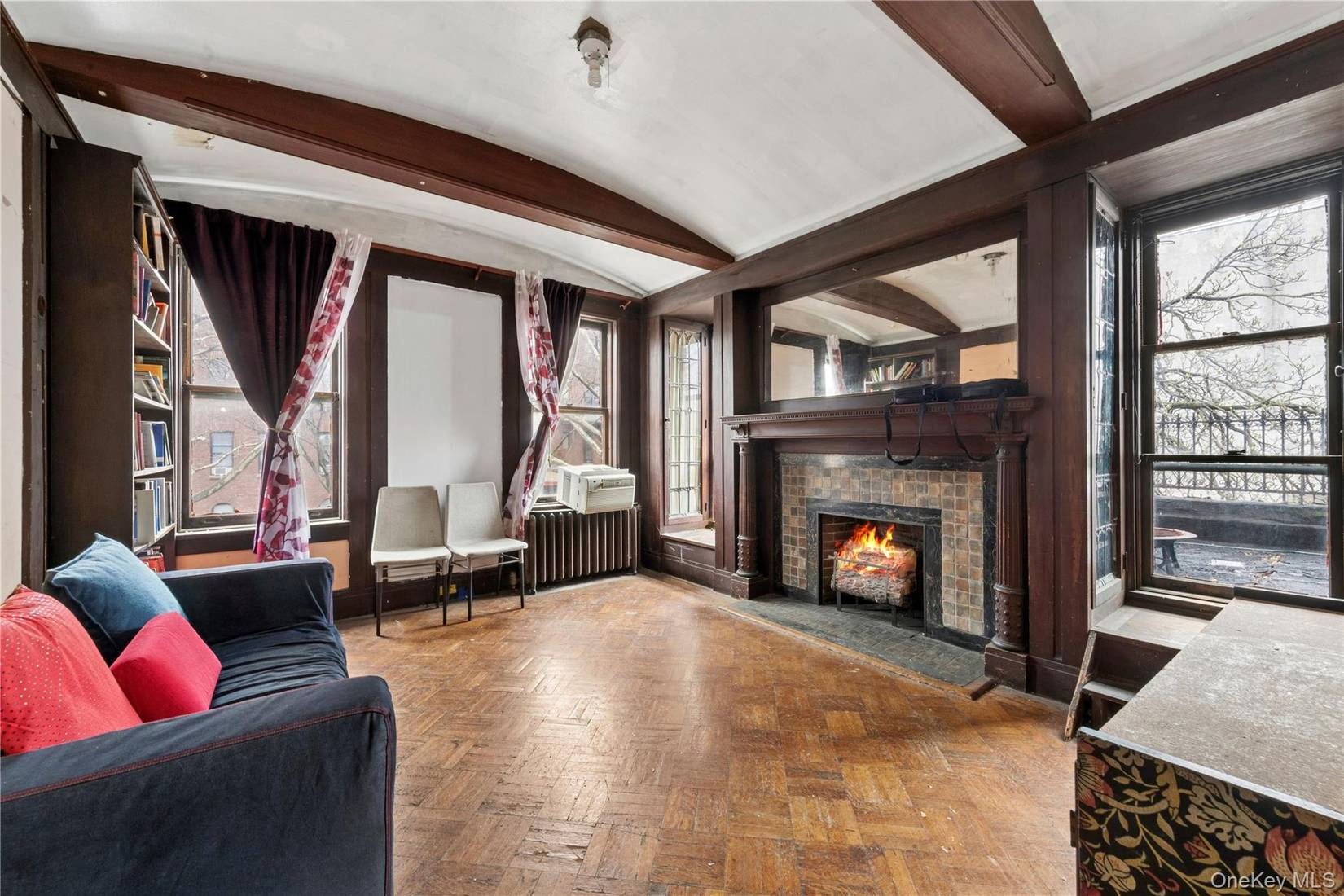 room with fireplace, door to terrace